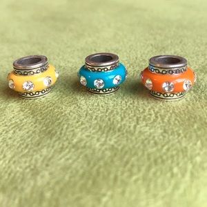 Three Brighton spacer bead charms